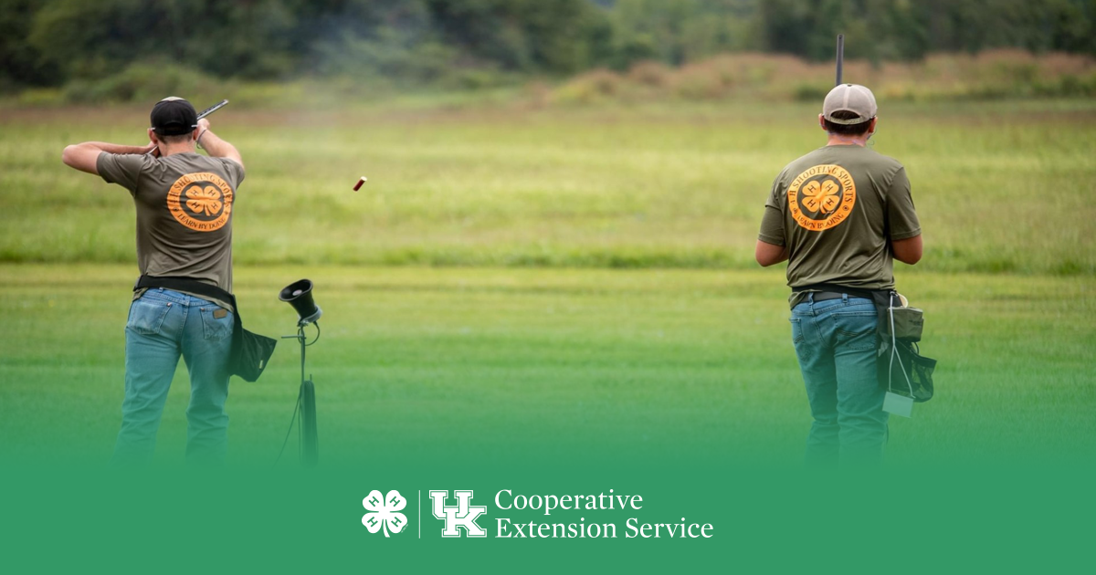 2 4-H boys participating in skeet shooting